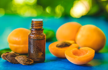 Apricot kernel oil in a bottle. Selective focus.