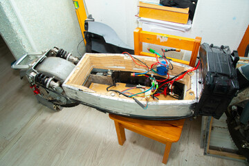 disassembled electric scooter pulled out battery