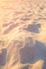 Fine sand on a beach vertical background, summer vacation background concept
