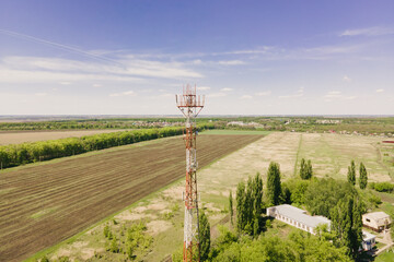 Telephone mast of cell site tower with 5G and 4G base station. Aerial view of telecom antenna