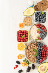 Set of healthy vegan food ingredients with muesli, oatmeal, avocado, flaxseed, fruits, cereals