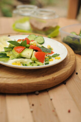 Summer salad on white plate