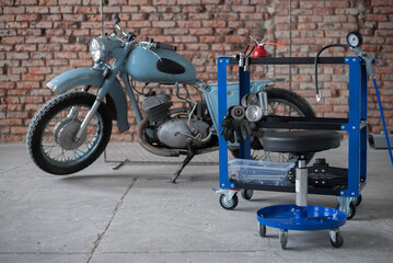 Old motorcycle garage concept background.