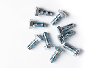 New metal bolts on a white background. Set of building tools for repair.