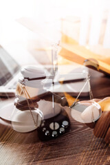Business and lawyers discussing contract papers with brass scale on desk in office. Law, legal services, advice, justice and law concept