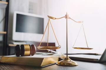 Business and lawyers discussing contract papers with brass scale on desk in office. Law, legal...