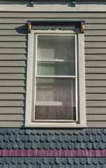 Sash window with Victorian frame on an old inn in rural America