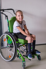 Fototapeta na wymiar Special child on wheelchair. Girl in school uniform on the background of the school board.