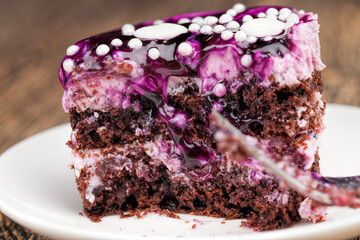 blueberry-flavored cake covered with blueberry jam