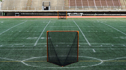 Lacrosse nets on a stadium field.