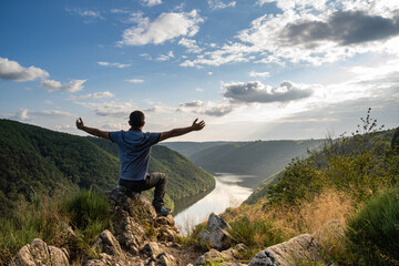 A man contemplating Gratte Bruyere landscape in Correze during golden light - July 2021