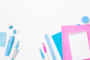 Flat lay frame with school and office supplies on a white background