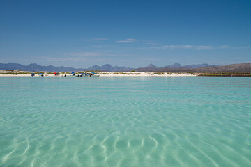 Seascape of baja California Sur. Loreto Mexico with mountains blue sea and white sand beach