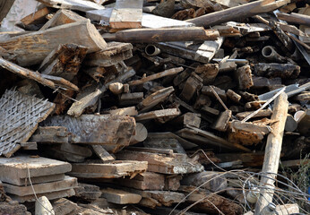 Old wooden and metal parts from broken house as background