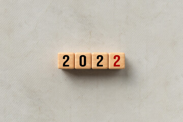 cube with message 2022 on concrete background