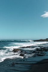 Fototapeta na wymiar Black sands beach in Hilo Hawaii
