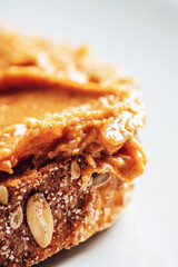 Close-up of peanut butter on toasted bread.