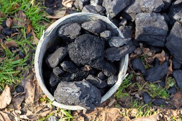 Coal bucket. Heating a country house during the cool season in autumn and winter