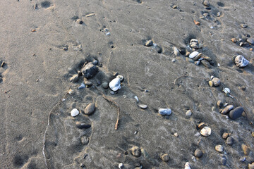 Fototapeta na wymiar colorful pebbles on the sand