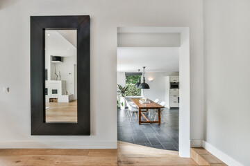 Modern room with different furniture and the bright light coming from the window