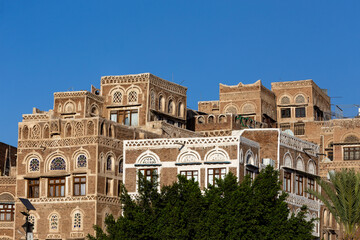Fototapeta premium Traditional architecture in Sanaa, Yemen. Inhabited for more than 2.500 years at an altitude of 2.200 m, the Old City of Sanaa is a UNESCO World Heritage City.