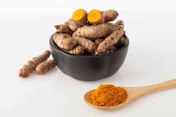 Fresh organic root and turmeric powder - Curcuma longa; Healthy Food.
