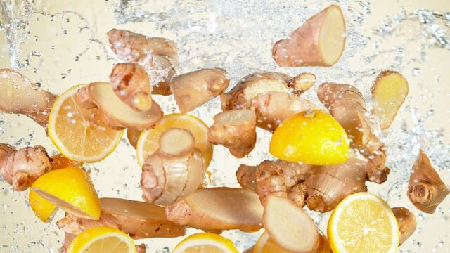 Super Slow Motion Shot of Flying Ginger Cuts, Lomen Slices and Water Side Splash at 1000 fps.