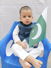 Little Cute Boy Holding Pakistan Flag and Celebrate 75th Independence Day 2021