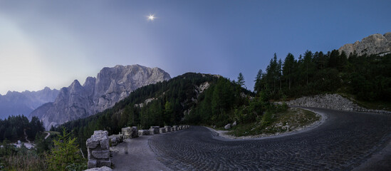 panorama of the Julian Alps at sunrise from paving stone corner of Vrsic-Pass, Slovenia