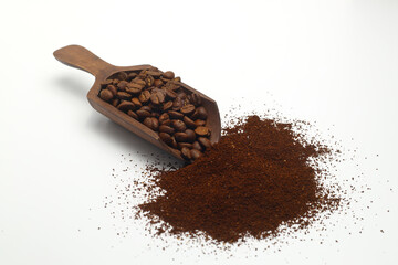 Coffee beans in a wooden scoop isolated on a white background. Roasted coffee beans isolated. A wooden scoop with coffee.