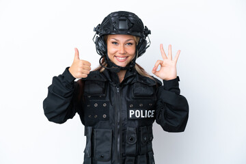 SWAT Russian woman isolated on white background showing ok sign and thumb up gesture