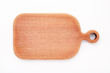 Empty vintage wooden cutting board isolated on white background top view.
