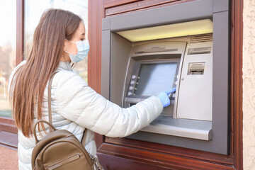 Woman withdrawing money from ATM