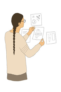 Man pinning up research on wall