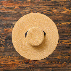 Stylish hat on wooden background