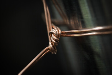 Selective of a metal wire tied on a pipe