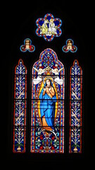  shot of the beautiful window art in a religious Christian or catholic chapel 
