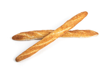 Overhead view of two crossed crusty bread French sticks or baguettes on a white background