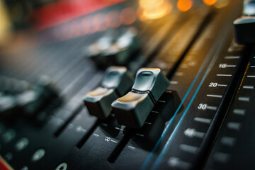Closeup of a mixing desk during a concert.