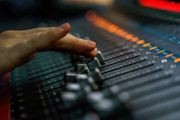 Audio mixer console and professional sound mixing. Audio mixer control panel with buttons and...