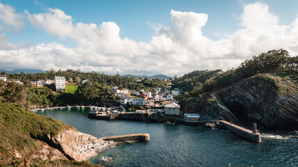 Fototapeta na wymiar Panoramic view of the village and the port of Viavelez, Asturias, on a sunny day.