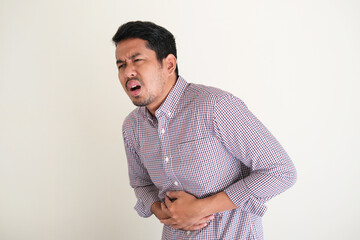 Asian man got bad stomach ache