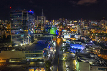 Landscape of roads surrounded by modern buildings and lights at night in the Dominican Republic