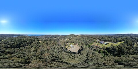 Aerial 360 degree images of New south wales Australian homes on large acre plots with distance ocean view.