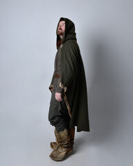 Full length  portrait of  young handsome man  wearing  medieval Celtic adventurer costume with...