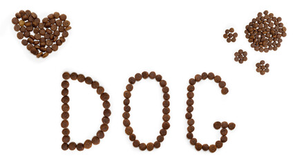 Dry dog food in the shape of a heart, dog paw and letters DOG, isolated on white background. Heart shaped pet food. Food for cats and dogs. Healthy food concept for pets.
