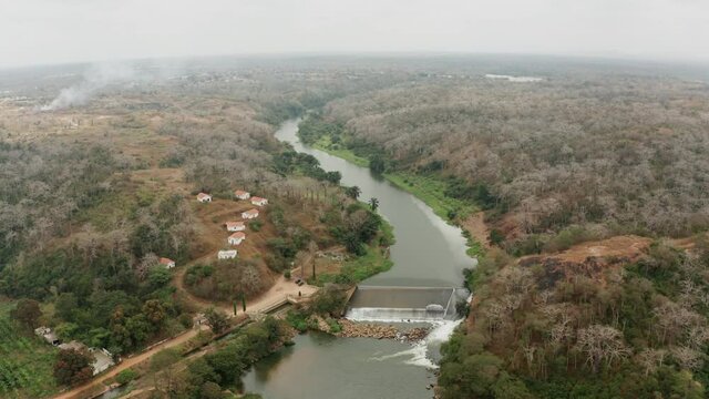 Traveling up over a river, dam on a river in Angola, Africa 1