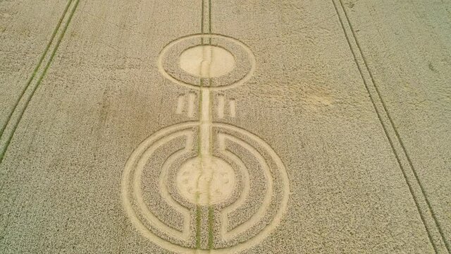 Sydmonton rural wheat field countryside farmland crop circles art aerial rising tilt down view