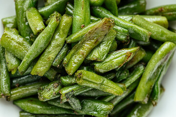 Closeup on portion of fried green string beans garnish