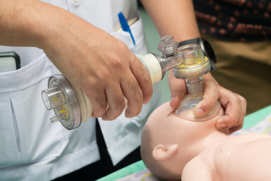 students are learning how to rescue the patients in emergency. CPR training with CPR doll and Ambu Bag.